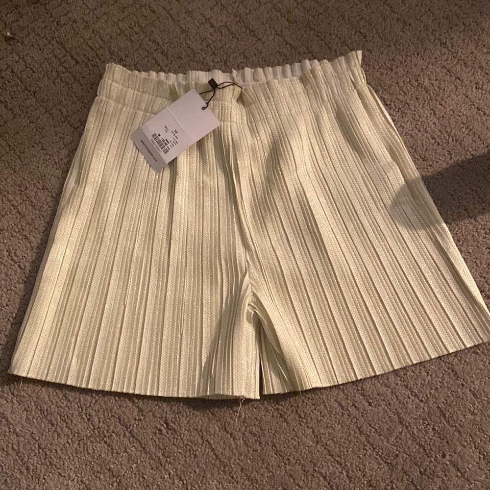 Bought from Israel. Only sold one day. Gold fancy shorts.